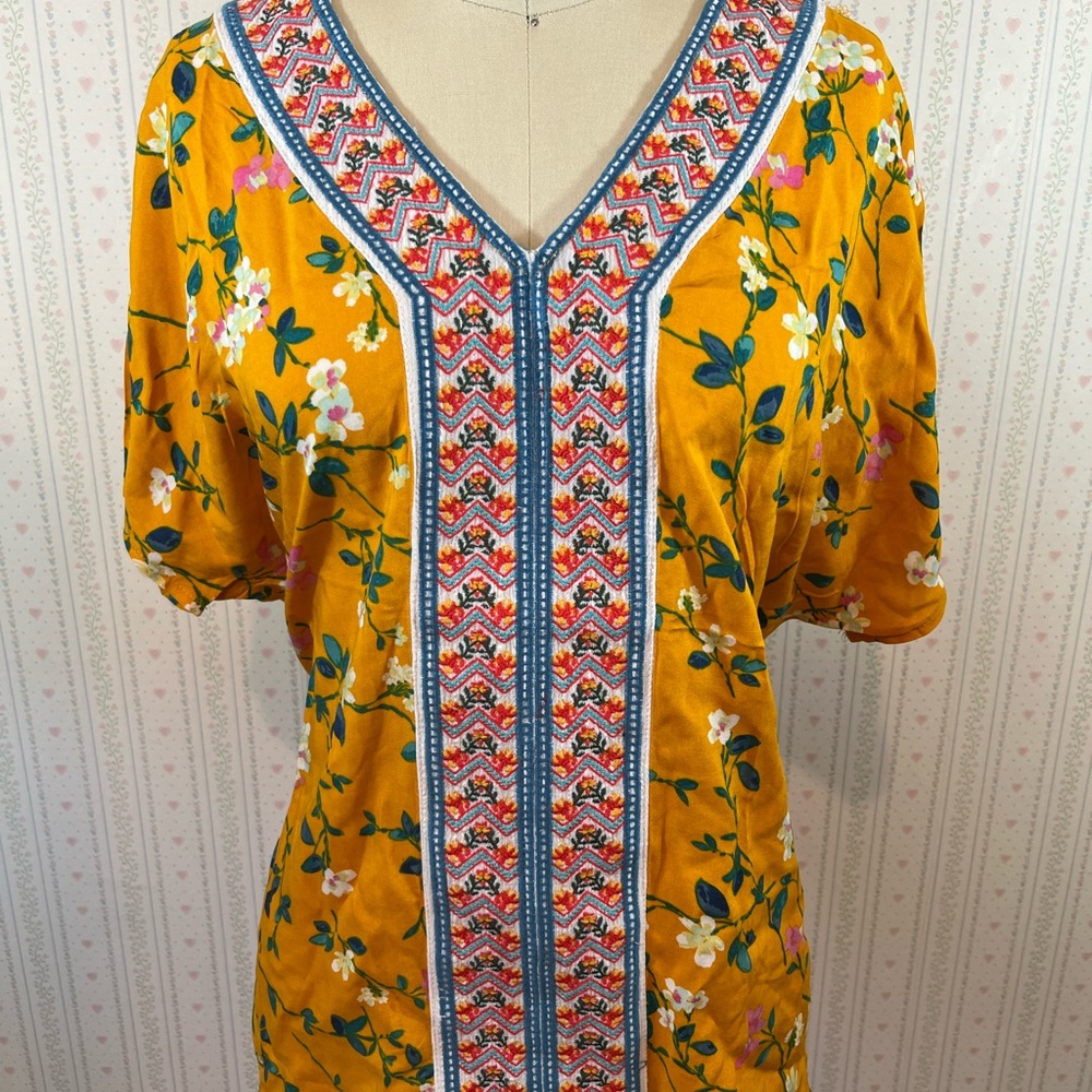 Boho style mustard yellow shirt.